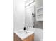 Modern bathroom with stylish vanity, ample lighting, and sleek design at 879 Delaware St, Denver, CO 80204