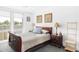 Cozy bedroom with classic wooden furniture and comfortable bedding at 879 Delaware St, Denver, CO 80204