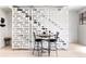 Chic dining area with modern table, chairs, and stylish room divider at 879 Delaware St, Denver, CO 80204