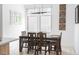Well-lit dining area showcasing a stylish table, chairs, and contemporary light fixture at 879 Delaware St, Denver, CO 80204