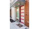 Stylish front door with a vibrant color, enhancing curb appeal and highlighting modern design elements at 879 Delaware St, Denver, CO 80204