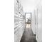 Bright hallway with unique room divider and telescope by the window at 879 Delaware St, Denver, CO 80204