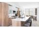 Well-appointed kitchen featuring a large island, modern appliances and seating for casual dining at 879 Delaware St, Denver, CO 80204