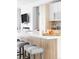 Close-up on kitchen island with elegant stools, ample counter space, and stylish decor at 879 Delaware St, Denver, CO 80204