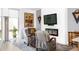 Cozy living room with stylish furniture, a fireplace, and artistic decor at 879 Delaware St, Denver, CO 80204