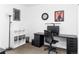 Well-lit home office featuring a spacious desk and ample storage at 879 Delaware St, Denver, CO 80204
