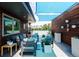 Relaxing patio with comfortable seating, plants, and a beautiful city view, ideal for outdoor enjoyment at 879 Delaware St, Denver, CO 80204