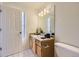 Cozy bathroom with single sink vanity and stylish lighting at 12288 W Dorado Pl # 301, Littleton, CO 80127