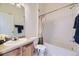 Bathroom featuring a vanity and a shower-tub combination at 12288 W Dorado Pl # 301, Littleton, CO 80127