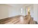 Bright bedroom with wood-look floors and an en-suite bathroom, offering a spacious and modern feel at 12288 W Dorado Pl # 301, Littleton, CO 80127