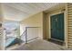 Inviting condo entrance with a covered landing, secure front door, and neighborhood views at 12288 W Dorado Pl # 301, Littleton, CO 80127