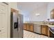 Updated kitchen featuring stainless steel appliances, ample counter space, and tile flooring at 12288 W Dorado Pl # 301, Littleton, CO 80127