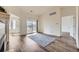 Bright, airy living room with a sliding glass door to a balcony and wood-look floors at 12288 W Dorado Pl # 301, Littleton, CO 80127