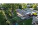 Aerial view of home with spacious yard, mature trees and a covered back patio with furniture at 820 Cottonwood Ave, Centennial, CO 80121