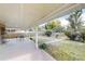 A covered patio with furniture overlooks a serene backyard at 820 Cottonwood Ave, Centennial, CO 80121