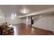 Finished basement with flooring, drop ceiling, and painted walls at 820 Cottonwood Ave, Centennial, CO 80121