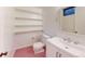 Bathroom with shelves, toilet, sink, and vanity at 820 Cottonwood Ave, Centennial, CO 80121