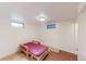 Bedroom with finished floors, windows, a bed, and ceiling lighting at 820 Cottonwood Ave, Centennial, CO 80121