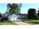 Charming brick home with a well-manicured front yard and a two-car garage at 820 Cottonwood Ave, Centennial, CO 80121