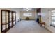Bright living room with large window, fireplace, display case and neutral carpet at 820 Cottonwood Ave, Centennial, CO 80121