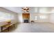 Spacious living room featuring a brick fireplace and natural lighting at 820 Cottonwood Ave, Centennial, CO 80121
