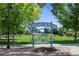 Welcome to Aviation Park, featuring lush greenery and a unique sign with airplane propeller accents at 1820 Newland Ct # 201, Lakewood, CO 80214