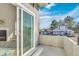 Concrete balcony featuring a sliding glass door and serene neighborhood views at 1820 Newland Ct # 201, Lakewood, CO 80214