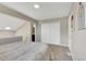 Bright bedroom featuring neutral walls, carpet, closet, and ensuite bath at 1820 Newland Ct # 201, Lakewood, CO 80214