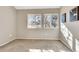 Cozy bedroom featuring two windows with outside view and a contemporary art piece at 1820 Newland Ct # 201, Lakewood, CO 80214