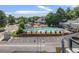 Relax by the community pool, with lounge chairs and landscaping, plus convenient parking at 1820 Newland Ct # 201, Lakewood, CO 80214