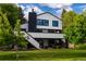 Beautifully designed two-story home with a well-maintained lawn and lush greenery creating a serene setting at 5516 S Havana Ct, Englewood, CO 80111