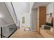 Hallway with staircase and built-in storage, featuring modern design elements and ample natural light at 5516 S Havana Ct, Englewood, CO 80111