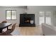 Living room with modern fireplace and wood floors, flowing natural light at 5516 S Havana Ct, Englewood, CO 80111