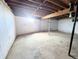 Unfinished basement space with concrete floor and support columns at 11897 Roxburg St, Strasburg, CO 80136