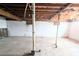 Unfinished basement with exposed pipes and concrete floor at 11897 Roxburg St, Strasburg, CO 80136