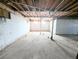 Spacious unfinished basement with concrete floor and support beams at 11897 Roxburg St, Strasburg, CO 80136