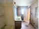 Bathroom with dual sinks and a bathtub at 11897 Roxburg St, Strasburg, CO 80136