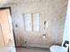Bathroom featuring a toilet and cabinet at 11897 Roxburg St, Strasburg, CO 80136