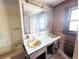 Bathroom featuring a dual sink vanity at 11897 Roxburg St, Strasburg, CO 80136