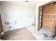 Inside a bedroom with a wood trimmed closet at 11897 Roxburg St, Strasburg, CO 80136