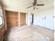Bedroom featuring unfinished walls and floors, closet space and light, offering an opportunity for renovation and customization at 11897 Roxburg St, Strasburg, CO 80136