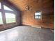 Bright living room featuring tile flooring, scenic views from its picture windows and chandelier lighting at 11897 Roxburg St, Strasburg, CO 80136