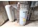 Basement water heater and pressure tank, concrete walls at 11897 Roxburg St, Strasburg, CO 80136