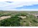 Expansive yard with lush greenery and fencing, offering ample outdoor space at 11897 Roxburg St, Strasburg, CO 80136