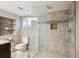 Modern bathroom with glass shower, stylish tile, granite countertop, and elegant fixtures at 424 S Pennsylvania St, Denver, CO 80209