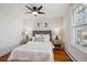 Inviting bedroom featuring hardwood floors, a ceiling fan and beautiful natural light at 424 S Pennsylvania St, Denver, CO 80209