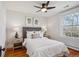 Comfortable bedroom with a ceiling fan, hardwood floors, and lots of natural light at 424 S Pennsylvania St, Denver, CO 80209