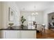 Bright dining room with hardwood floors, modern chandelier, and natural light at 424 S Pennsylvania St, Denver, CO 80209