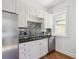 Well-appointed kitchen featuring stainless steel appliances and tiled backsplash at 424 S Pennsylvania St, Denver, CO 80209