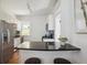 Modern kitchen with stainless steel appliances and a breakfast bar at 424 S Pennsylvania St, Denver, CO 80209